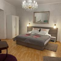 Łóżko lub łóżka w pokoju w obiekcie Corte Apartman