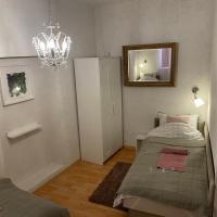 Łóżko lub łóżka w pokoju w obiekcie Corte Apartman