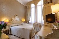 Posteľ alebo postele v izbe v ubytovaní Hotel Canaletto