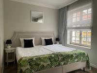 Posteľ alebo postele v izbe v ubytovaní Lavoo Boutique Apartments