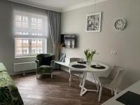 Televízia a/alebo spoločenská miestnosť v ubytovaní Lavoo Boutique Apartments