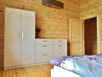A bed or beds in a room at Chata Natan