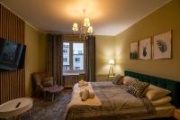 Posteľ alebo postele v izbe v ubytovaní Apartament Moniuszki 22