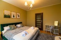 Posteľ alebo postele v izbe v ubytovaní Apartament Moniuszki 22