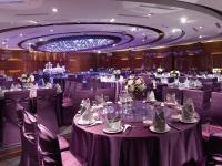 a banquet hall with purple tables and chairs at City Suites - Kaohsiung Chenai in Kaohsiung
