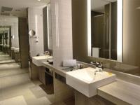 a bathroom with two sinks and a large mirror at City Suites - Kaohsiung Chenai in Kaohsiung