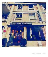 a store front of a building with a guitar in the window at The Originals Boutique, Hôtel d&#39;Angleterre, Le Havre, centre, plage in Le Havre