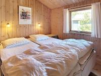 Postel nebo postele na pokoji v ubytování 8 person holiday home in Nexø-By Traum