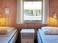 Postel nebo postele na pokoji v ubytování 8 person holiday home in Nexø-By Traum