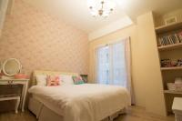 a small bedroom with a bed and a window at Misto B&amp;B in Taitung City