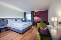 Łóżko lub łóżka w pokoju w obiekcie Hotel Walserwirt