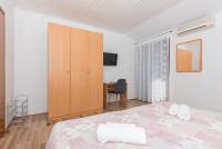 Posteľ alebo postele v izbe v ubytovaní Apartmani Češljar