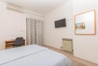 Posteľ alebo postele v izbe v ubytovaní Apartmani Češljar