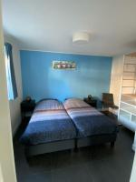 Postel nebo postele na pokoji v ubytování Zoutelande vakantiewoning