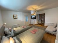Łóżko lub łóżka w pokoju w obiekcie Corte Apartman