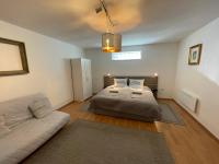 Łóżko lub łóżka w pokoju w obiekcie Corte Apartman