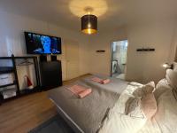 Telewizja i/lub zestaw kina domowego w obiekcie Corte Apartman