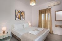 Posteľ alebo postele v izbe v ubytovaní SEA BREEZE APARTMENTS