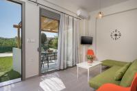 Televízia a/alebo spoločenská miestnosť v ubytovaní SEA BREEZE APARTMENTS