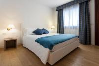 Łóżko lub łóżka w pokoju w obiekcie Hotel Luna