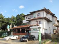 two cars parked in front of a house at Stefan Family Hotel in Kranevo