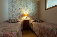 A bed or beds in a room at Apartamentos Top Medieval