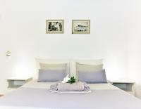 Postel nebo postele na pokoji v ubytování Thomas Apartments Katapola - Chora