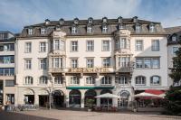 a large white building with a sign on it at ACHAT Sternhotel Bonn in Bonn