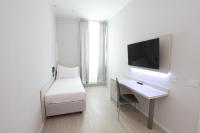 Telewizja i/lub zestaw kina domowego w obiekcie Cadorna Luxury Hotel