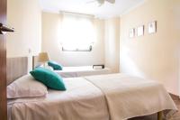 A bed or beds in a room at Frentemar 2 Deluxe