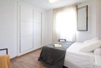 A bed or beds in a room at Frentemar 2 Deluxe