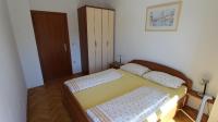 Łóżko lub łóżka w pokoju w obiekcie Apartmani Totić