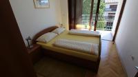 Łóżko lub łóżka w pokoju w obiekcie Apartmani Totić