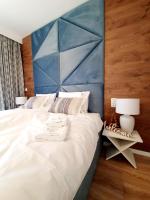 Posteľ alebo postele v izbe v ubytovaní Apartament Szyszka Izerski Resort - strefa z sauną