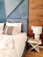 Posteľ alebo postele v izbe v ubytovaní Apartament Szyszka Izerski Resort - strefa z sauną