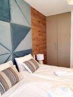 Posteľ alebo postele v izbe v ubytovaní Apartament Szyszka Izerski Resort - strefa z sauną