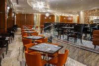 a restaurant with tables and chairs and a bar at Moon Palace Nizuc - All Inclusive in Cancún