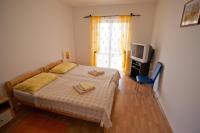 Postel nebo postele na pokoji v ubytování Apartments Marinić