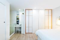 A bed or beds in a room at Del Parque Flats Especerias Balcony