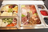 a tray filled with different types of food at Hotel zum Schiffchen in Wolfhagen