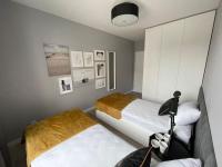 Posteľ alebo postele v izbe v ubytovaní Całkowicie nowy Apartament przy plaży