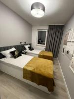 Posteľ alebo postele v izbe v ubytovaní Całkowicie nowy Apartament przy plaży