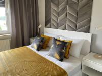 Posteľ alebo postele v izbe v ubytovaní Całkowicie nowy Apartament przy plaży