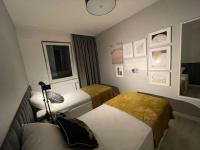 Posteľ alebo postele v izbe v ubytovaní Całkowicie nowy Apartament przy plaży