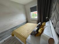 Posteľ alebo postele v izbe v ubytovaní Całkowicie nowy Apartament przy plaży
