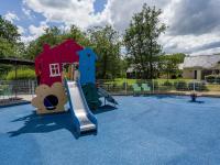 a playground with a slide on a blue playground at Holiday Home Cottage Confort 3 Pers- by Interhome in Saumur