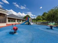 a playground with a slide and a play equipment at Holiday Home Cottage Confort 3 Pers- by Interhome in Saumur