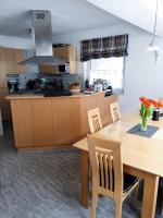 A kitchen or kitchenette at Glemmy Appartements inkl Sommercard