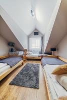 Posteľ alebo postele v izbe v ubytovaní Gościniec pod Lilijką