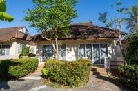 a house with bushes in front of it at Gooddays Lanta Beach Resort SHA in Ko Lanta